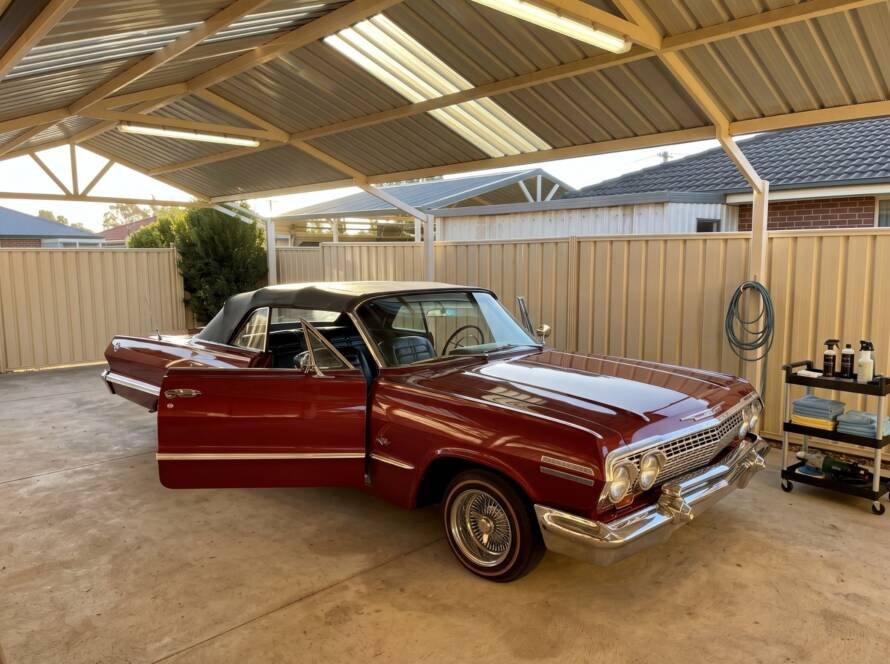 Fully restored vintage red Chevrolet convertible with highly polished paint and chrome.